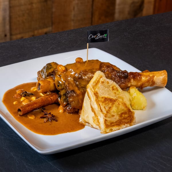 Chili Basil Thai Cuisine's Massaman Lamb Shank with potatoes, roti, cinnamon stick, and star anise.